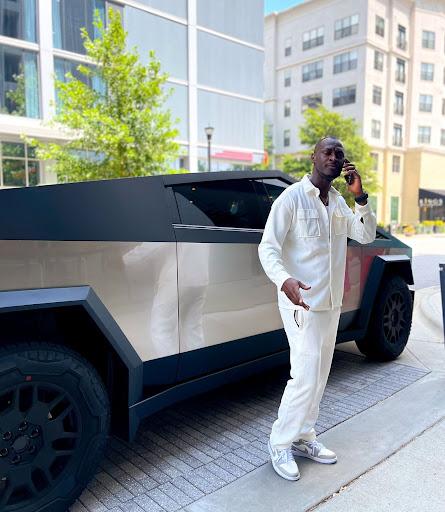 Looks Good! King Kaka poses beside a Tesla Cybertruck